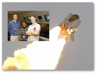 Space shuttle launching with two men posing in front of a model shuttle.