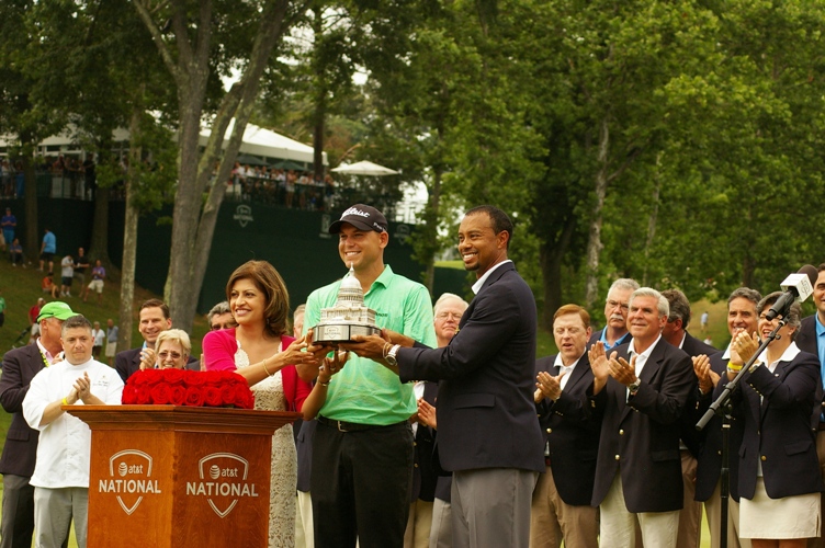 Bill Haas and Tiger trophy podium