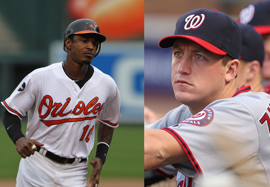 Smiling young woman with blonde hair in front of a textured wall.