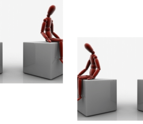 Wooden mannequin sitting thoughtfully on a gray cube against a white background.