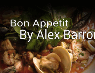 A delicious seafood dish garnished with fresh herbs and clams.