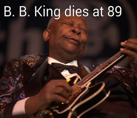 B.B. King passionately plays the guitar on stage.