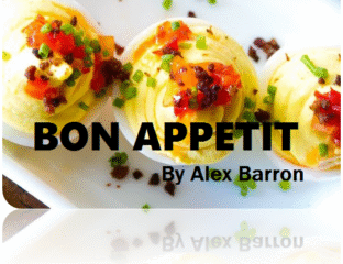 Delicious appetizer bites garnished with herbs and spices on a white plate.
