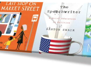A book cover and a coffee cup with a flag design on a white surface.