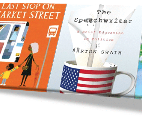A book cover and a coffee cup with a flag design on a white surface.