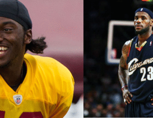 Two basketball players in action, one in a yellow jersey and the other in a dark jersey.