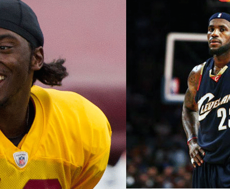 Two basketball players in action, one in a yellow jersey and the other in a dark jersey.