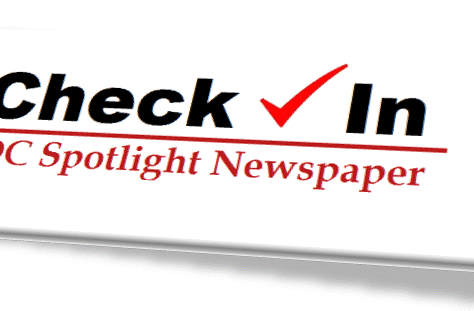 Logo of Check Live Spotlight Newspaper in bold and red text.