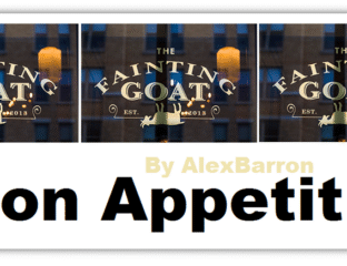 Sign for The Fainting Goat restaurant with goat illustration and text.