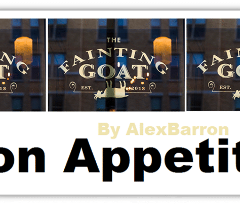Sign for The Fainting Goat restaurant with goat illustration and text.