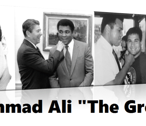 Muhammad Ali adjusting a man's tie in a black-and-white photo.