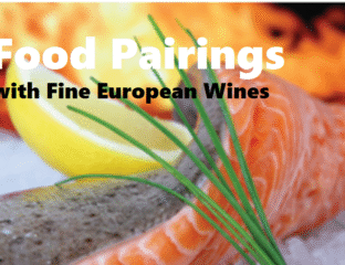 A vibrant food pairing display featuring lemon, salmon, chives, and bread.