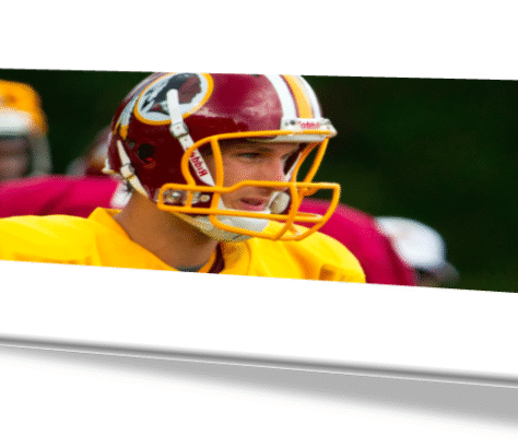 Football player in a red and yellow uniform with a helmet.