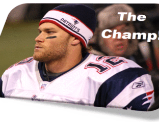 Tom Brady in a Patriots uniform looking determined on the sidelines.