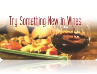 A glass of red wine with food and the text encouraging trying new wines.