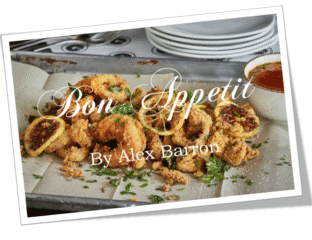 Delicious golden-brown baked pastries garnished with herbs on a white platter.