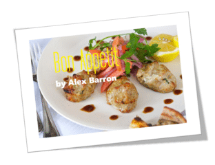 Delicious roasted chicken drumsticks garnished with fresh herbs and lemon slices.