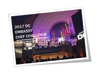 Stage setup for the 2017 DC Embassy Chef Challenge event at night.