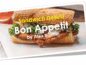 A delicious sandwich with melted cheese and fresh greens on a crusty baguette.
