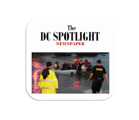 Rescue workers assist flooded area residents during a storm.