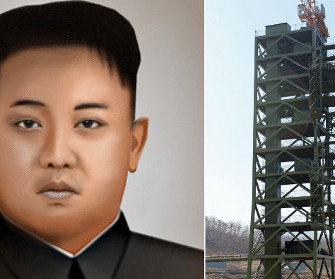 Portrait of a man next to a tall, industrial rocket launch structure.