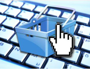 A digital shopping cart icon on a keyboard key.