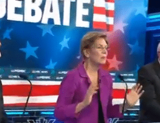 A woman speaking passionately during a televised debate with patriotic American imagery.