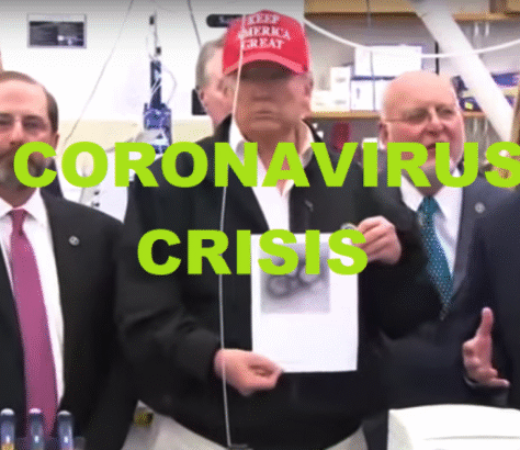 Donald Trump holding a document during a coronavirus crisis briefing.