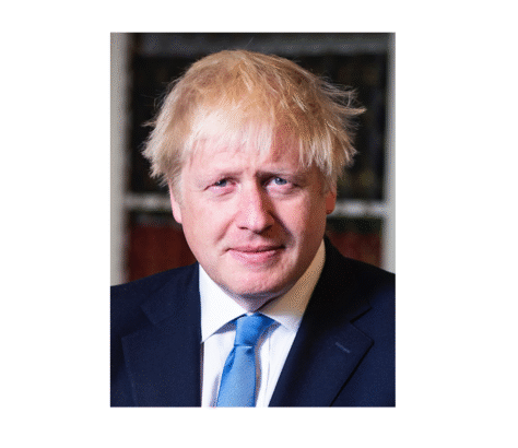 Portrait of a man with tousled blond hair and a blue tie.