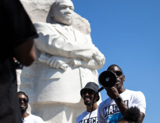 People take photos near the Martin Luther King Jr. Memorial statue.