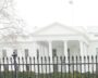The White House with a black fence in the foreground.