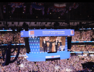 Democratic National Convention 2024 with speakers on stage and a large crowd.