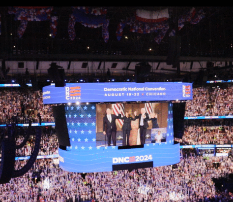 Democratic National Convention 2024 with speakers on stage and a large crowd.